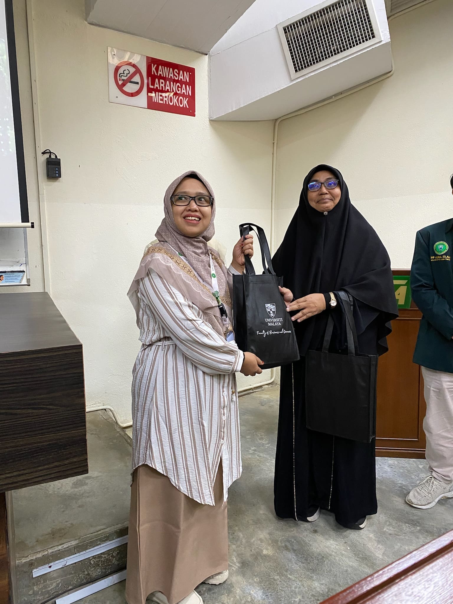 Universiti Malaya & SMA Global School, represented by Ms. Nur Jamilah, M.Pd (Vice Principal)